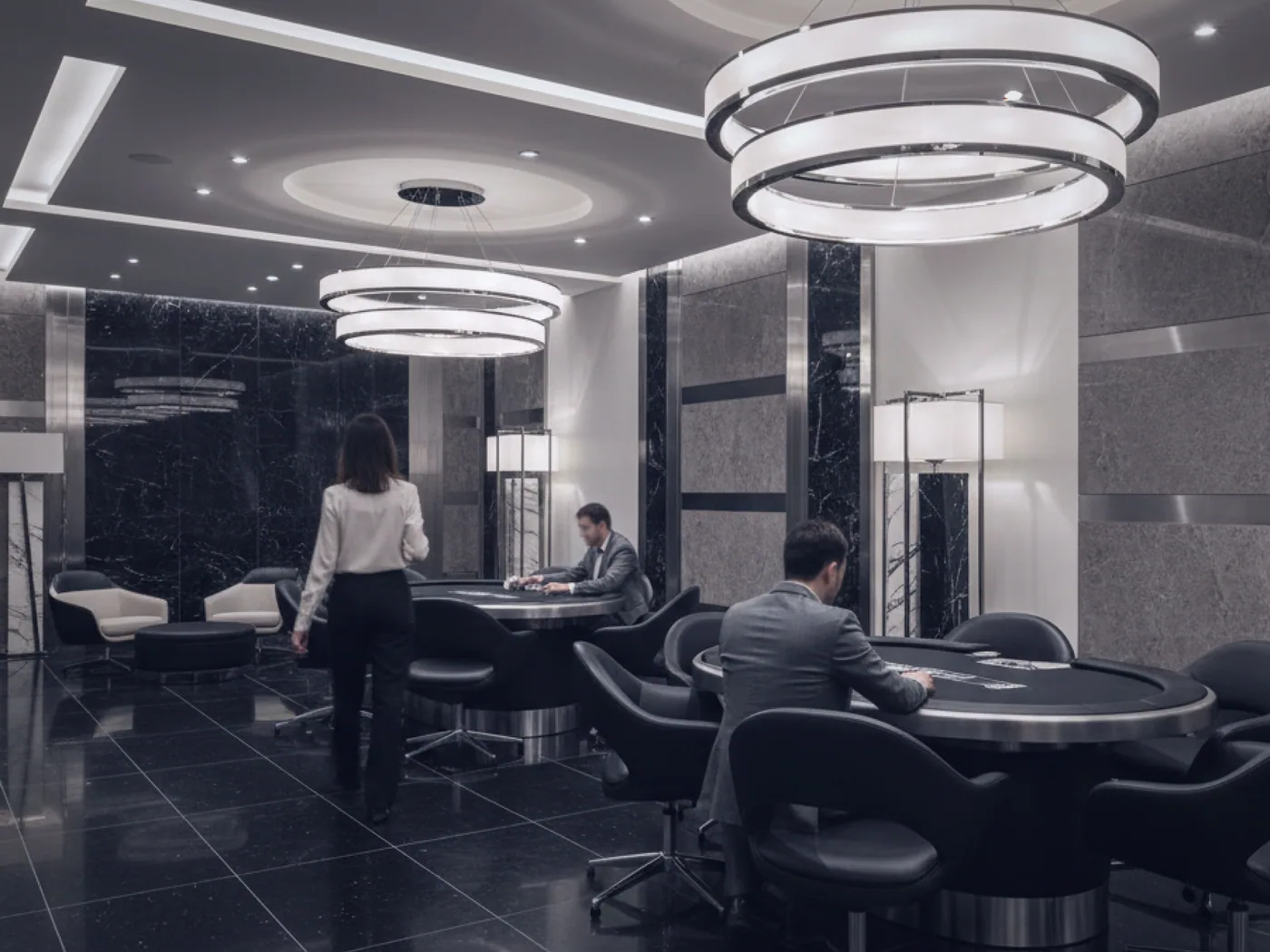 A quieter side lounge with worn leather armchairs set apart from the main tables